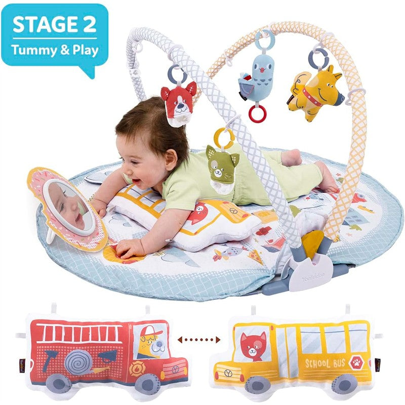 Baby playing on Yookidoo Baby Gym Lay to Sit-Up Playmat with colorful hanging toys and mirror, designed for tummy time.