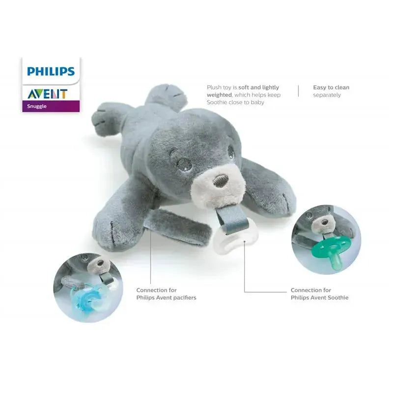 Soft gray plush seal toy for babies, includes a pacifier attachment. Easy to clean, promotes soothing comfort.